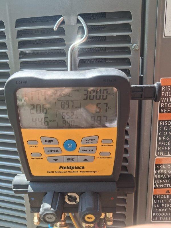 Completed installation of 2.5-ton air conditioning system with evaporator coil at rear location. Installed new thermostat, condensate pump, and performed system flush prior to startup. Utilized Fieldpiece SMAN manifold gauges to verify proper refrigerant pressures and system performance, confirmed all operating parameters within manufacturer specifications, and reconnected electrical components per code requirements.