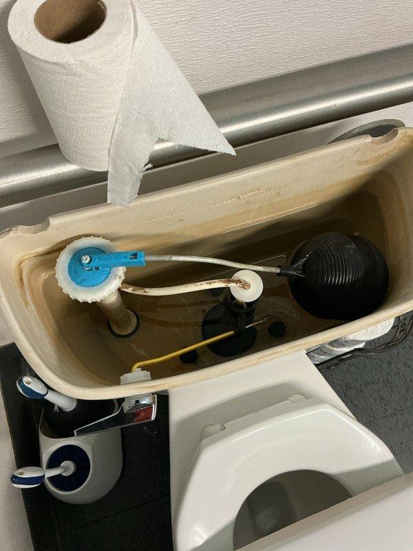 Responded to non-functioning toilets in building sixteen. Upon inspection, removed tank lid and assessed internal flush mechanism components including flush valve assembly, flapper valve, fill valve, and float ball system. Identified and addressed issues with tank components to restore proper flushing operation. All internal mechanisms inspected for proper function, mineral deposits noted on tank interior. Toilet restored to working condition and tested for proper flush cycle operation.