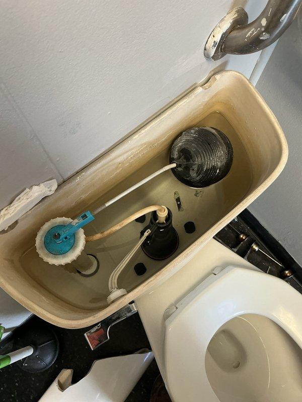 Responded to non-functioning toilets in building sixteen. Upon inspection, removed tank lid and assessed internal flush mechanism components including flush valve assembly, flapper valve, fill valve, and float ball system. Identified and addressed issues with tank components to restore proper flushing operation. All internal mechanisms inspected for proper function, mineral deposits noted on tank interior. Toilet restored to working condition and tested for proper flush cycle operation.