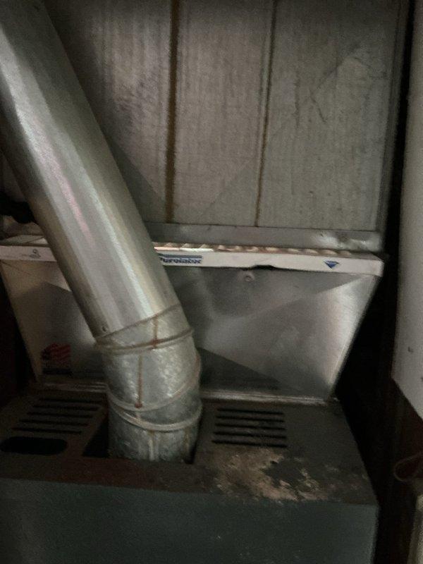 Completed comprehensive Gold AC Inspection on 13-year-old air conditioning system with air handler located in kitchen closet. Performed thorough evaluation of ductwork connections, filter housing assembly, and equipment components, documenting current condition with photographic evidence. System confirmed operational at time of inspection, with all mechanical components accessible and functioning as designed.