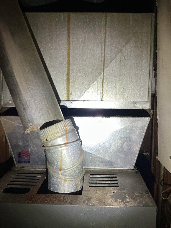 Completed comprehensive Gold AC Inspection on 13-year-old air conditioning system with air handler located in kitchen closet. Performed thorough evaluation of ductwork connections, filter housing assembly, and equipment components, documenting current condition with photographic evidence. System confirmed operational at time of inspection, with all mechanical components accessible and functioning as designed.