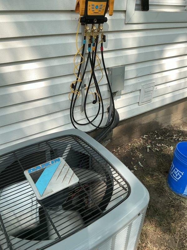 Completed comprehensive Gold plan AC maintenance inspection on a 5-year-old outdoor air conditioning system. Performed full system diagnostics using digital manifold gauges to verify refrigerant pressures, superheat, and subcooling values. Conducted visual inspection of condenser unit, confirmed proper operation of compressor and condenser fan motor, checked electrical connections, and verified system efficiency rating of 13.0 SEER as indicated on unit specifications. All components operating within normal parameters with no issues identified. System is in good working condition and ready for continued service.