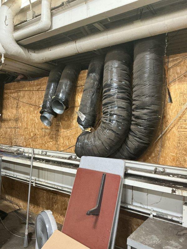 Completed a two-day complete HVAC system installation including a new furnace and air conditioning unit. Interior work included installation of furnace with flexible insulated ductwork routing, white metal supply plenum, filter housing, and ventilation components in the mechanical room. Exterior installation featured placement of outdoor condenser unit on elevated wooden platform with protective wire cage, connected via refrigerant lines to indoor equipment, with all electrical connections and startup procedures completed successfully.