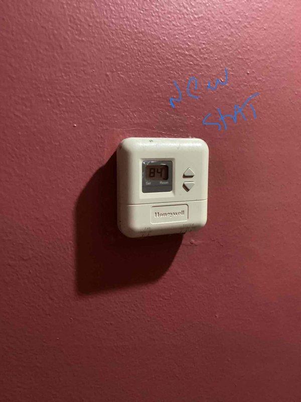 Provided estimate for complete HVAC system replacement including natural gas furnace and air conditioning unit located in basement. Existing equipment is 30+ years old and non-operational. Assessed installation requirements, utility markings on exterior, and existing thermostat configuration to determine scope of replacement work needed.