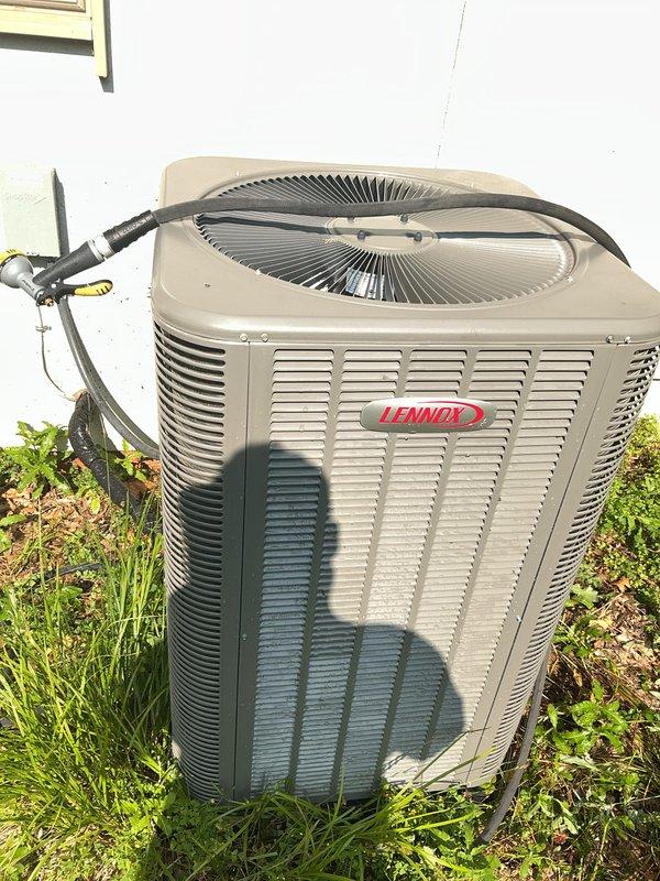 Completed comprehensive Gold AC Inspection on a 1-year-old Lennox condenser unit located in the backyard. Performed complete system evaluation including visual inspection of outdoor condenser unit, refrigerant line connections, electrical components, and operational testing. Unit found to be in excellent working condition with proper airflow through louvered panels, secure refrigerant line connections with insulation intact, and all safety components functioning as designed. Documented equipment condition with photographic evidence showing clean exterior surfaces, proper installation on grade level, and no visible signs of wear or deterioration. Confirmed system is operating within manufacturer specifications and homeowner reported satisfactory cooling performance.