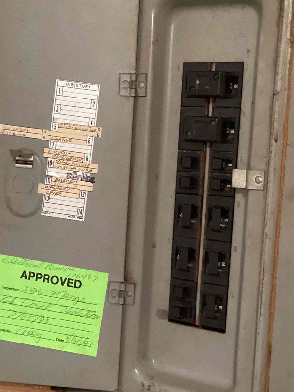 Responded to service call for non-operational air conditioning system over 20 years old located in basement. Performed comprehensive assessment of existing HVAC equipment and electrical infrastructure, including inspection of furnace, condensate drainage system, and main electrical panel with circuit breakers. Documented current equipment configuration and provided estimate for complete AC system replacement due to age and failure of existing unit.