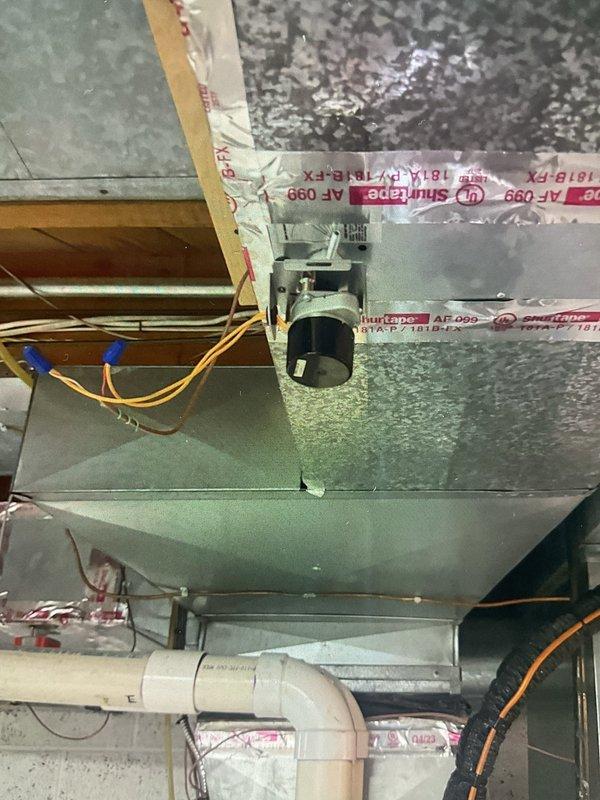 Completed repair of HVAC zoning system by replacing defective zone damper in basement air conditioning system. Installed new zone damper in ductwork and verified proper operation of HZ322 zone control panel with all three zones functioning correctly. System tested and confirmed operational with all zone indicators illuminated and damper responding appropriately to zone calls.