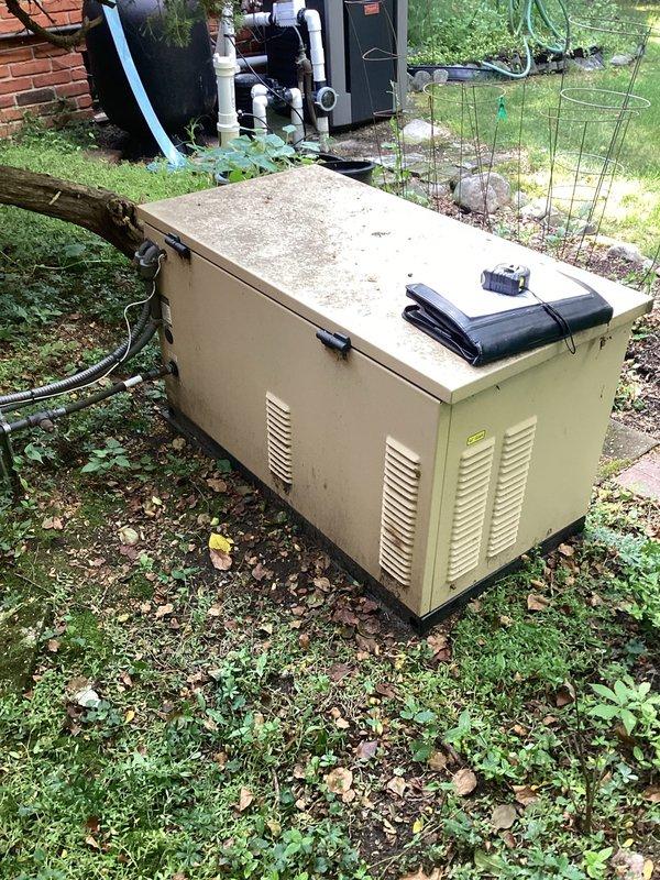 Conducted on-site evaluation of existing residential standby generator for replacement estimate. Unit exhibited significant weathering, surface corrosion, and deterioration from prolonged outdoor exposure. Documented generator condition, location constraints in side yard utility area, existing electrical service configuration including meter base and disconnect boxes, and conduit routing. Photographed equipment positioning relative to HVAC system and assessed accessibility for future installation. Provided comprehensive assessment for generator replacement specifications and electrical service requirements.