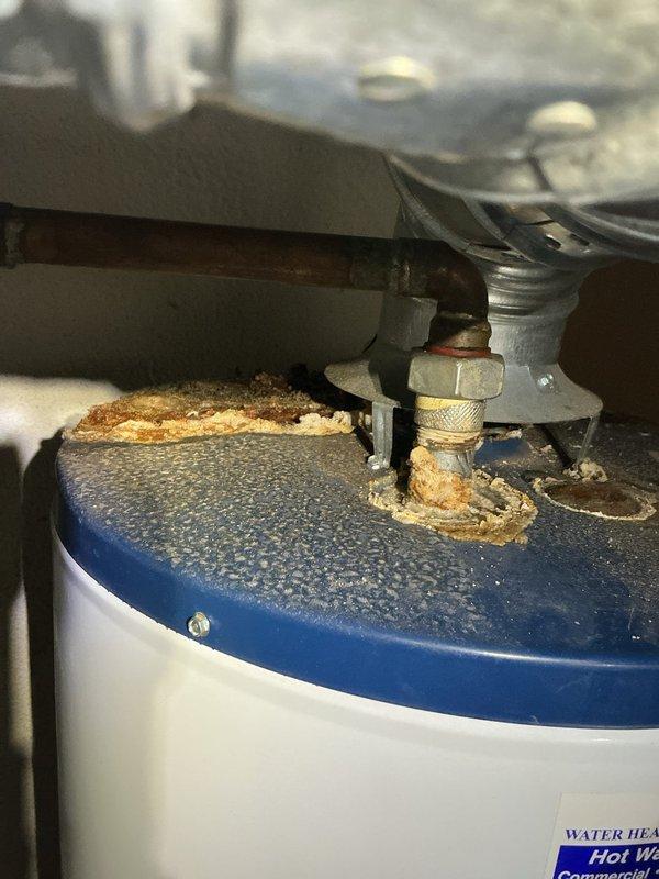 Completed Gold AC inspection on 12-year-old system located in basement. Performed comprehensive evaluation of all air conditioning components including refrigerant lines, connections, and associated equipment. Documented significant corrosion and deterioration on refrigerant line insulation and pipe connections, as well as rust buildup on water heater components in mechanical space, indicating moisture exposure concerns that may require future attention to prevent system degradation.