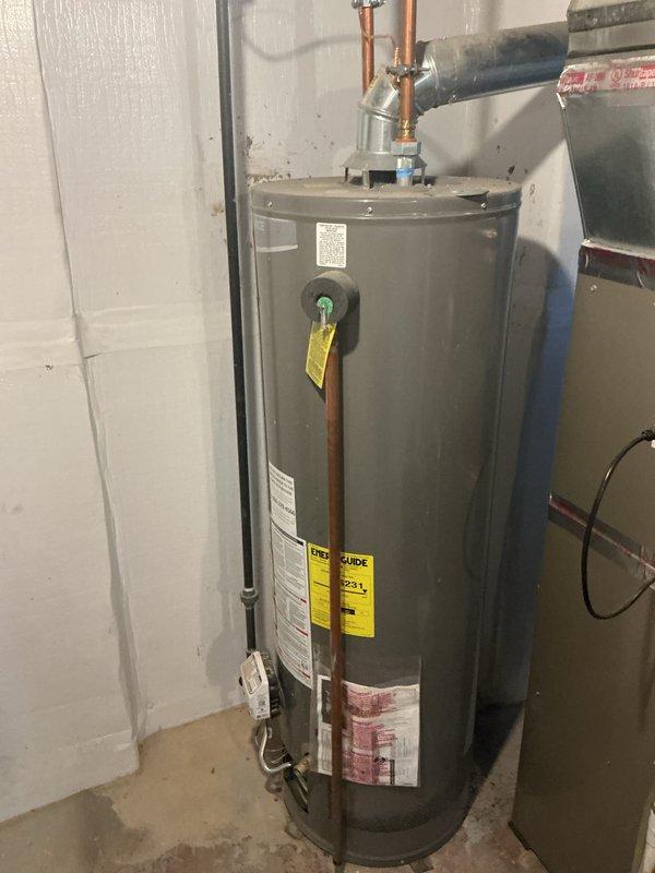 Completed comprehensive tune-up and city certification inspection on residential gas furnace system. Performed thorough inspection of all internal components including burner assembly with confirmed proper flame operation across all four burners, gas valve assembly with verified electrical connections, blower motor assembly, and PVC venting system. Inspected and evaluated thermostat operation, humidifier functionality, and hot water tank condition including pressure relief valve and copper supply lines. All systems found operating within normal parameters and documented with photographs for certification records.