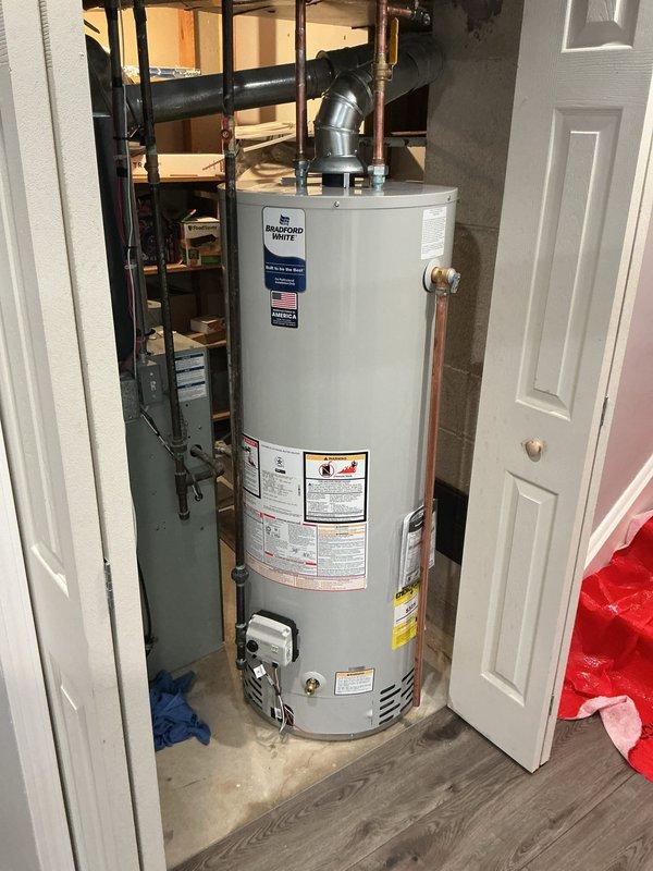 Installed a 50-gallon Bradford White tanked water heater in utility closet. Connected copper supply lines, installed PVC venting with proper elbow configuration, and reconnected all plumbing fixtures. Verified proper operation, checked for leaks, and ensured all manufacturer specifications and safety labels were visible and compliant.