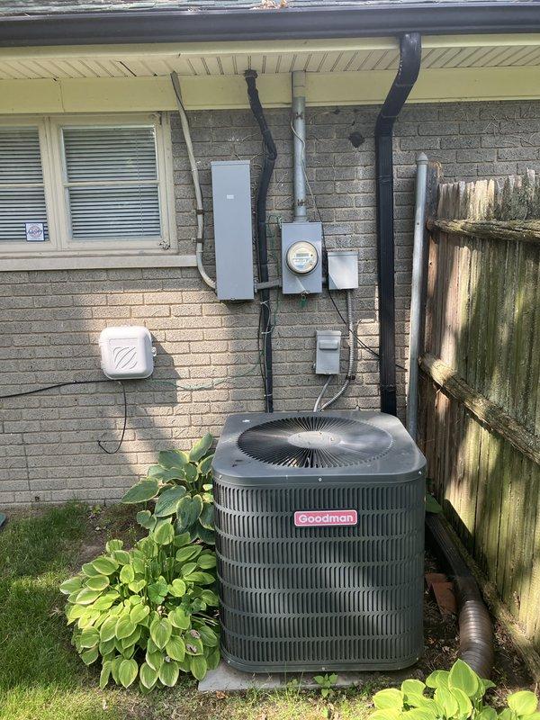 Performed GOLD AC inspection on 3-year-old Goodman air conditioning system with filter change service. Evaluated outdoor condenser unit, indoor air handler located in basement, and Emerson programmable thermostat operation. System currently operational; provided estimate for replacement options due to R22 refrigerant phase-out concerns.