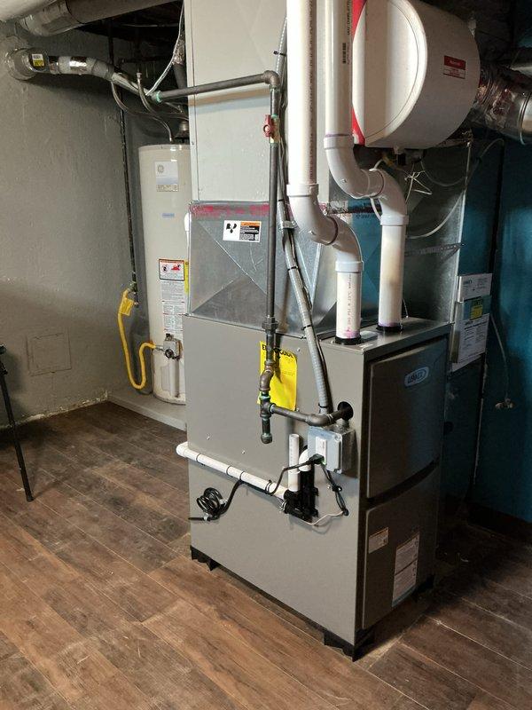 Completed installation of 45,000 BTU residential furnace in utility room with all necessary mechanical and electrical connections. Installed new PVC venting system routed through exterior wall, connected gas line, and performed electrical reconnection work. Applied for mechanical and electrical permits, completed remeasurement for utility rebate qualification, and verified all equipment is operating to manufacturer specifications.
