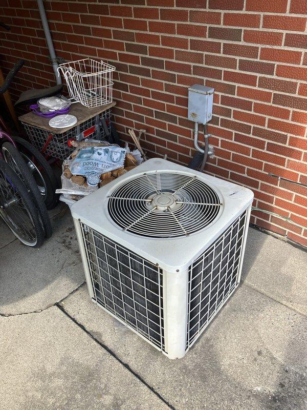 Responded to a no heating or cooling call for a 30-year-old R22 air conditioning system located in the backyard. Upon inspection, found the compressor was not operational on the aging outdoor unit. Provided an estimate for complete system replacement due to the age of the equipment, obsolete R22 refrigerant, and failed compressor component.