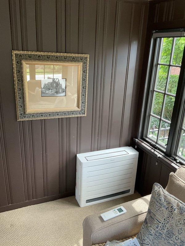 Completed installation of ductless mini-split system in residential living area. Mounted indoor wall unit below window, installed outdoor condenser, ran refrigerant lines and electrical connections, and performed system commissioning with pressure and temperature verification using diagnostic gauges to ensure proper refrigerant charge and optimal system performance.