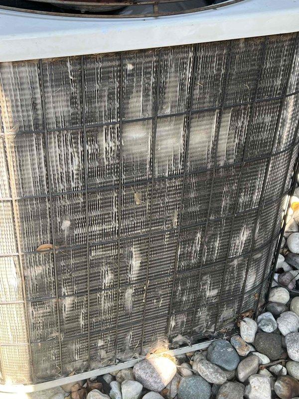 Responded to cooling complaint where system was unable to maintain setpoint and running continuously. Performed diagnostic evaluation on both outdoor units (7-year and 15-year models). Found severely restricted airflow on outdoor coil due to heavy accumulation of dirt, debris, and environmental contaminants blocking heat exchange fins. Electrical contactor showed significant dust buildup and signs of age-related wear. Documented equipment condition with photos showing extent of coil contamination and component deterioration. Completed check-with-office-on-work diagnostic assessment to provide recommendations for coil cleaning service and potential component replacement to restore proper system operation and cooling capacity.