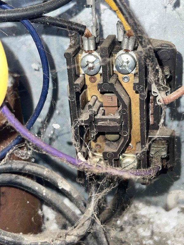 Responded to cooling complaint where system was unable to maintain setpoint and running continuously. Performed diagnostic evaluation on both outdoor units (7-year and 15-year models). Found severely restricted airflow on outdoor coil due to heavy accumulation of dirt, debris, and environmental contaminants blocking heat exchange fins. Electrical contactor showed significant dust buildup and signs of age-related wear. Documented equipment condition with photos showing extent of coil contamination and component deterioration. Completed check-with-office-on-work diagnostic assessment to provide recommendations for coil cleaning service and potential component replacement to restore proper system operation and cooling capacity.