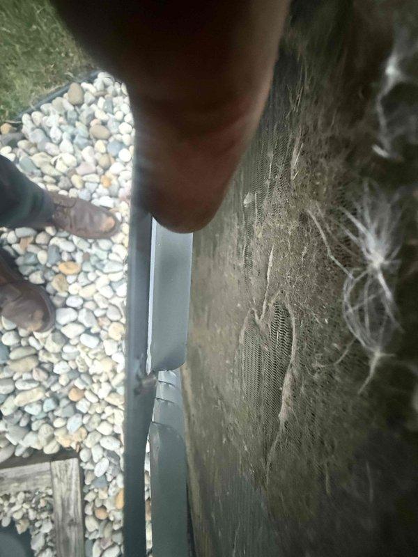Responded to service call for AC system not cooling to setpoint, with indoor temperature at 80°F while thermostat set to 75°F. Upon arrival, checked in at security gate and accessed 6-year-old Daikin outdoor condensing unit located at rear of property on decorative rock bed against building exterior. Opened top panel and performed diagnostic inspection of internal components. System was blowing cool air but failing to reach desired temperature. Completed troubleshooting procedures and necessary repairs to restore proper cooling operation and temperature control functionality.