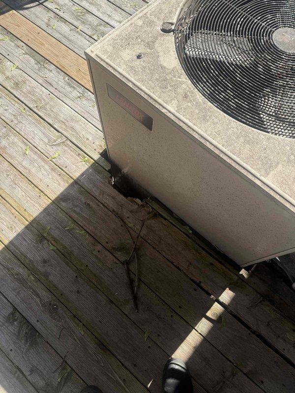 Completed comprehensive AC inspection and enrolled customer in Gold plan membership on-site. Performed full system evaluation of outdoor condenser unit located on deck, including inspection of humidifier, thermostat, and hot water tank as specified. Documented visible heat damage and soot accumulation on front access panel of condenser unit requiring further assessment, along with general weathering and dirt buildup on exterior cabinet. Verified refrigerant line insulation integrity and captured photographic documentation of unit condition for service records.