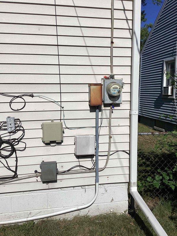 Conducted comprehensive site assessment for full HVAC system upgrade at residential property. Customer currently has gas-fired forced air heating system with existing ductwork infrastructure and humidifier in place, seeking to add central air conditioning and evaluate furnace replacement needs. Inspected existing basement mechanical room setup, documenting current ductwork configuration including main trunk lines, flexible connections, and humidification equipment. Evaluated exterior utility connections and electrical service capacity at meter location to determine adequacy for additional AC condenser unit installation. Assessed duct system integrity and sizing to confirm compatibility with proposed cooling system addition. Photographed existing equipment layout, electrical infrastructure, and available mounting locations for outdoor condensing unit. Provided recommendations for AC installation options and furnished replacement considerations based on current heating system condition a