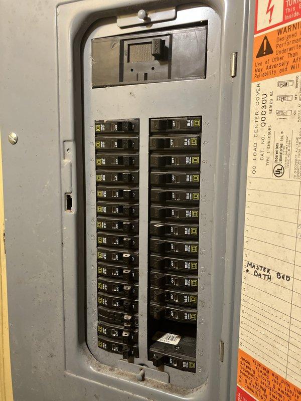 Conducted comprehensive site evaluation for whole home generator installation at residential property. Assessed existing electrical panel configuration, documenting current breaker layout and available capacity for generator integration. Evaluated exterior installation location adjacent to building foundation, noting existing utility meter placement, electrical conduit routing, and available space for generator pad placement and fuel line connections.