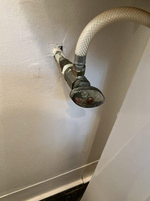 Responded to service call for non-functioning hot water side of bathroom sink faucet in 26-year-old home. Upon inspection, diagnosed failed hot water cartridge in the affected handle of the two-handle chrome faucet assembly. Shut off water supply at angle stop valve beneath sink, removed defective hot water handle and cartridge, and installed replacement cartridge compatible with existing faucet model. Reassembled handle assembly with white porcelain accent trim, restored water supply, and tested both hot and cold water flow to verify proper operation and absence of leaks. Confirmed no other plumbing fixtures were affected and that issue was isolated to single faucet cartridge failure, eliminating need for complete faucet replacement at this time.