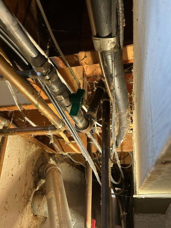 Responded to gas odor complaint in basement near dryer following installation of new appliance with gas line adapter. Conducted thorough inspection of gas piping system, including main supply lines, branch connections, and dryer hookup point. Performed leak detection testing using electronic gas detector and soap solution at all accessible joints, fittings, and connections throughout the basement gas distribution system. Located active leak at adapter connection point between existing gas line and new dryer installation. Shut off gas supply at branch valve and disconnected improper adapter fitting. Found adapter was not rated for gas service and lacked proper thread sealant application. Removed unsuitable adapter and cleaned pipe threads. Installed code-compliant gas connector with approved yellow CSST flexible gas line and proper brass fittings. Applied appropriate pipe thread sealant rated for natural gas applications. Reconnected dryer to gas supply using approved materials and meth