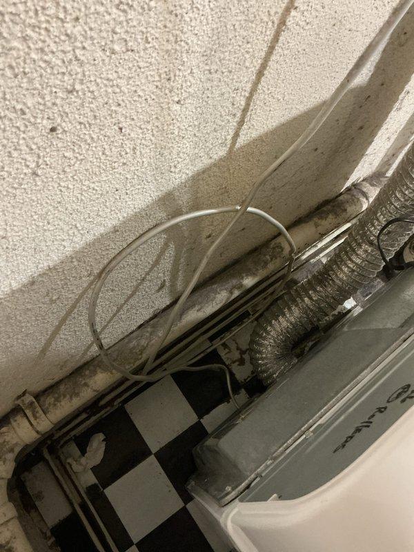 Responded to gas odor complaint in basement near dryer following installation of new appliance with gas line adapter. Conducted thorough inspection of gas piping system, including main supply lines, branch connections, and dryer hookup point. Performed leak detection testing using electronic gas detector and soap solution at all accessible joints, fittings, and connections throughout the basement gas distribution system. Located active leak at adapter connection point between existing gas line and new dryer installation. Shut off gas supply at branch valve and disconnected improper adapter fitting. Found adapter was not rated for gas service and lacked proper thread sealant application. Removed unsuitable adapter and cleaned pipe threads. Installed code-compliant gas connector with approved yellow CSST flexible gas line and proper brass fittings. Applied appropriate pipe thread sealant rated for natural gas applications. Reconnected dryer to gas supply using approved materials and meth