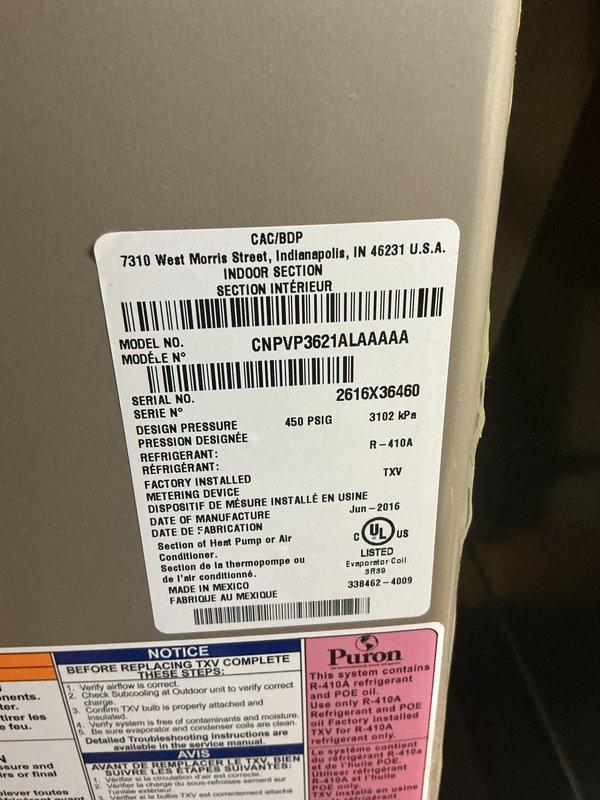 Completed comprehensive Gold AC inspection on Carrier indoor heat pump section, model CNPVP3621ALAAAAA, manufactured June 2016, utilizing R-410A refrigerant with TXV metering device. Performed multi-point system evaluation including visual inspection of unit labels, safety compliance verification, and photographic documentation of equipment condition. Unit confirmed operational at time of inspection with all manufacturer specifications and regulatory markings properly displayed.