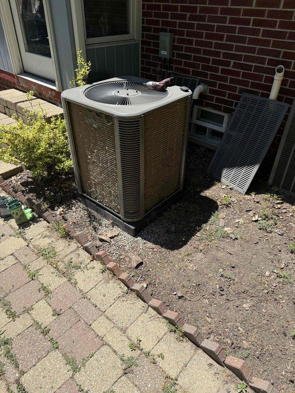 Completed comprehensive Gold AC inspection on a 1-year-old residential HVAC system with equipment located in the basement and outdoor condenser unit. Performed thorough examination of indoor furnace, air handler assembly with high-efficiency filtration system, PVC condensate drainage lines, and all associated ductwork connections. Inspected outdoor condenser unit including refrigerant line connections, electrical disconnect, fan operation, and coil condition. Verified proper system operation, checked refrigerant pressures, examined all electrical connections, and confirmed adequate airflow throughout the system. All equipment found to be functioning within normal parameters with no immediate service needs identified. System demonstrated proper installation with professional-grade components and clean operational condition throughout both indoor and outdoor units.