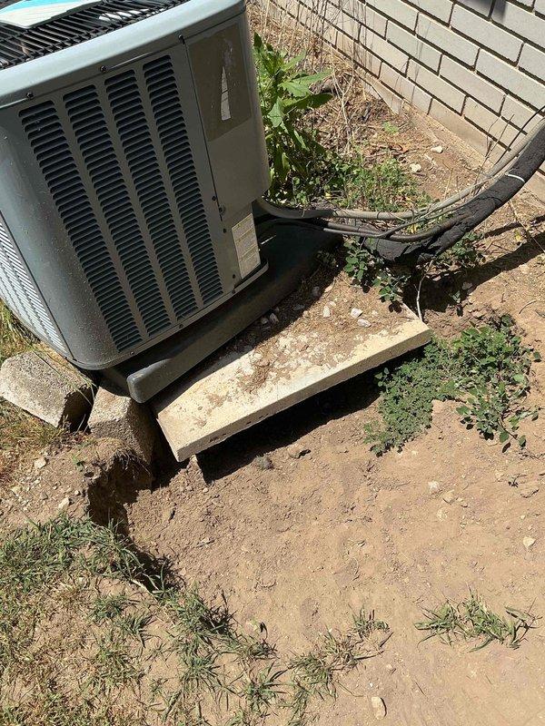 Performed comprehensive cooling season tune-up on 8-year-old Daikin air conditioning system. Conducted full operational assessment including refrigerant levels, electrical connections, compressor function, and airflow verification. Noted outdoor condenser unit sitting off-level on concrete pad; unit remains stable but recommend monitoring for future leveling needs. All system parameters operating within manufacturer specifications. Cleared vegetation and debris from around unit perimeter to ensure proper airflow and drainage. System confirmed operational and ready for cooling season.