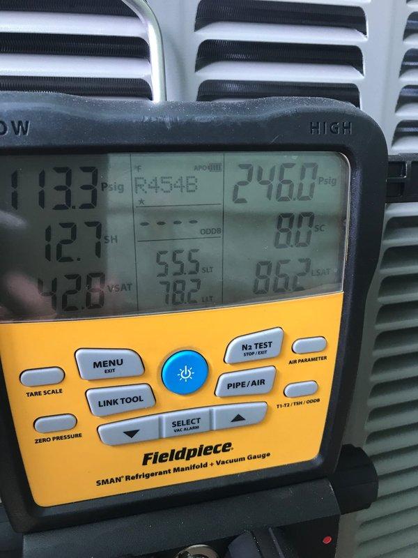 Successfully completed installation of 2.5-ton air conditioning system with matching uncased evaporator coil at rear location. System included new thermostat, condensate pump, refrigerant line flush, and humidifier reconnection. Obtained mechanical and electrical permits prior to installation, performed complete system startup with refrigerant charge verification, and confirmed proper operating pressures (113.3 psig low side, 246.0 psig high side), superheat at 12.7°F, and subcooling at 12.0°F. New Lennox condenser unit installed on exterior pad with proper line set connections and electrical hookup.