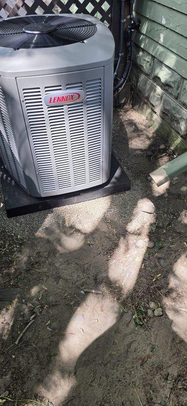 Successfully completed installation of 2.5-ton air conditioning system with matching uncased evaporator coil at rear location. System included new thermostat, condensate pump, refrigerant line flush, and humidifier reconnection. Obtained mechanical and electrical permits prior to installation, performed complete system startup with refrigerant charge verification, and confirmed proper operating pressures (113.3 psig low side, 246.0 psig high side), superheat at 12.7°F, and subcooling at 12.0°F. New Lennox condenser unit installed on exterior pad with proper line set connections and electrical hookup.