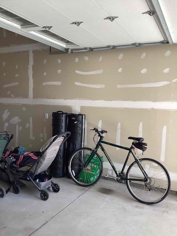 Conducted on-site evaluation for garage climate control system installation. Property currently utilizes boiler heating system for main residence. Assessed unfinished garage space with exposed drywall and determined equipment placement options and heating/cooling requirements for the detached or semi-finished area. Documented existing conditions including electrical access points, insulation status, and structural considerations for future HVAC equipment installation. Provided comprehensive estimate for climate control solutions suitable for garage conversion or workshop use.