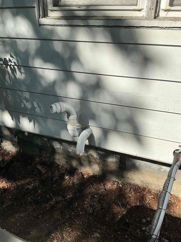 Completed full HVAC system installation including 45,000 BTU furnace, 1.5-ton air conditioning unit with rear discharge configuration, humidifier, and Honeywell Home programmable thermostat. Installed condensate drain piping on exterior wall with proper routing and secured all exterior components. Coordinated electrical reconnection requirements and obtained mechanical and electrical permits. System registered under AHRI certificate 215584603 for utility rebate qualification and verified all equipment operational upon completion.