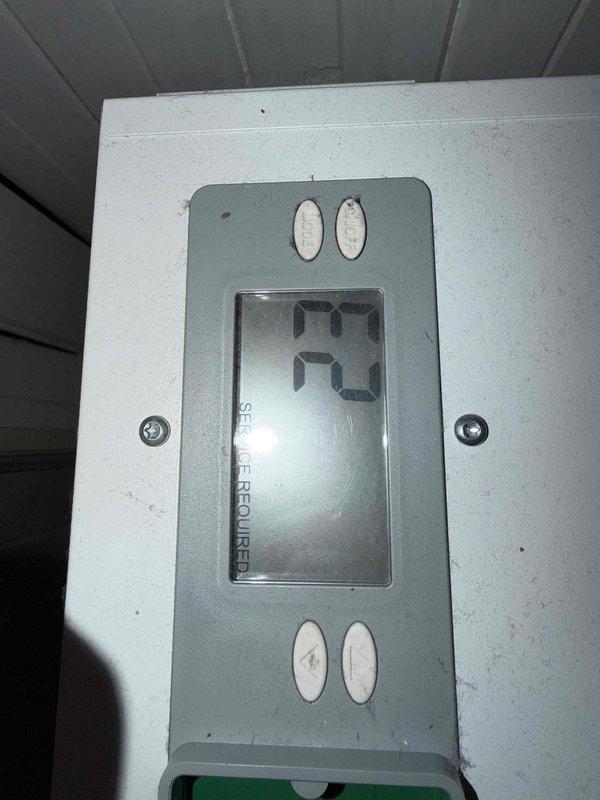 Responded to service call for non-operational dehumidifier and air purifier (model 1850) in basement, both units approximately five years old with no heat or cooling function. Upon arrival, performed diagnostic inspection of both IAQ units, examined control panels, electrical connections, and operational components. Verified thermostat/control display showing 73°F reading and assessed mounting configuration and power supply. Inspected equipment base assembly, support feet, and floor-level installation to ensure proper positioning and stability. Documented equipment condition with warning labels visible and intact on unit panels. Completed troubleshooting assessment of both basement IAQ systems to determine cause of complete operational failure.