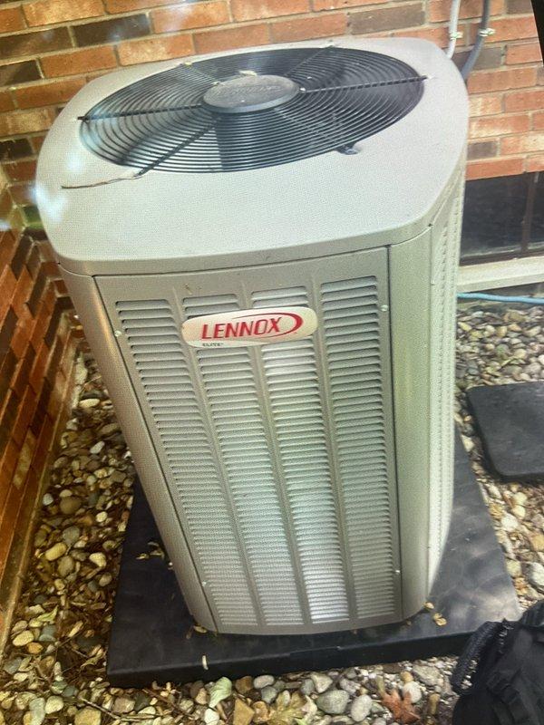 Completed Gold AC Inspection and routine maintenance on Lennox outdoor condensing unit. Performed comprehensive system evaluation including refrigerant pressure checks, electrical component testing, capacitor inspection, and contactor examination. Cleaned condenser coils, verified proper airflow through louvers, inspected fan motor operation and blade condition. Checked refrigerant line connections for leaks, confirmed proper drainage, and verified thermostat communication. All components operating within manufacturer specifications with no deficiencies noted. Unit found in excellent condition consistent with newer equipment age.