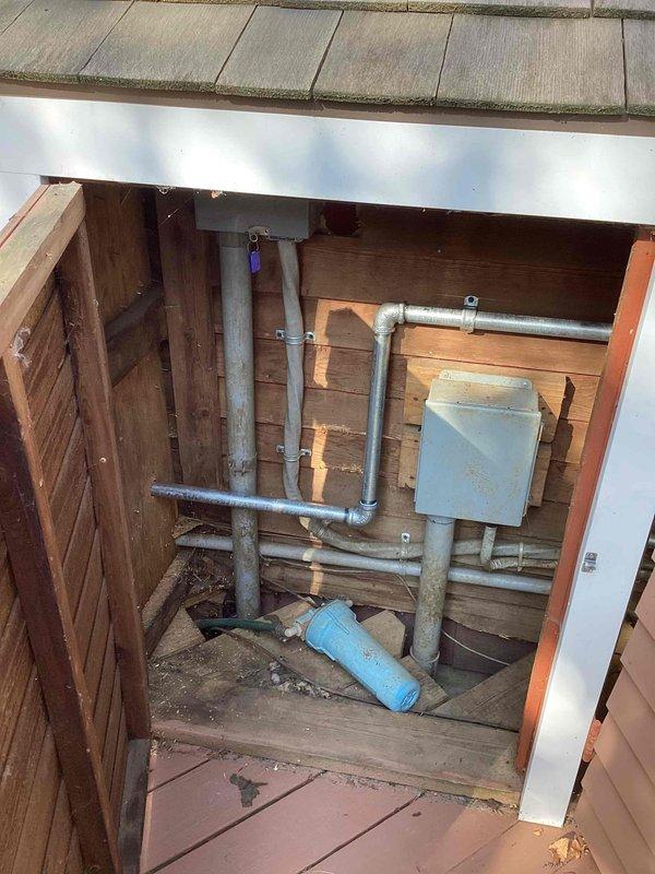 Responded to service call for routine AC maintenance on a 20-year-old outdoor air conditioning unit. Upon arrival, confirmed system was operational but had not received scheduled preventive maintenance since a previous repair visit. Performed comprehensive tune-up inspection including evaluation of outdoor condenser unit located in utility access area beneath deck structure, assessed thermostat operation showing 82°F display reading, and documented equipment condition through photographic records. System evaluated for replacement consideration due to age and provided estimate for new equipment installation.