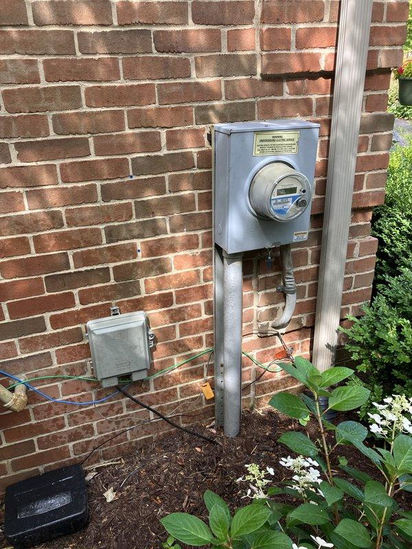 Completed comprehensive estimate for replacement of 10+ year old residential air conditioning system. Evaluated existing Bryant condensing unit located on exterior gravel pad with air handler and evaporator coil situated in basement. Documented current system configuration including electrical service, refrigerant line routing, and condenser placement on side of residence. Photographed existing equipment and installation area to assess replacement requirements. Advised property owner on importance of maintaining clear area around outdoor unit, free from debris and animal waste. Provided recommendations for complete AC system replacement due to age of equipment.