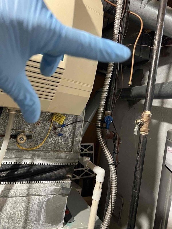 Performed comprehensive AC tune-up on residential split system including inspection of air handler components in basement and outdoor condensing unit. Verified refrigerant line connections, electrical wiring integrity, and condensate drain functionality. All system components operating within normal parameters; no deficiencies noted during preventive maintenance inspection.