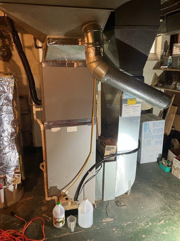 Completed comprehensive Gold AC Inspection on 4-year-old HVAC system with basement-located air handler. Performed multi-point inspection including visual assessment of furnace, ductwork connections, copper refrigerant lines, and air handler unit. Verified thermostat operation and temperature settings at 73 degrees, confirmed proper system functionality with all equipment operating as designed.