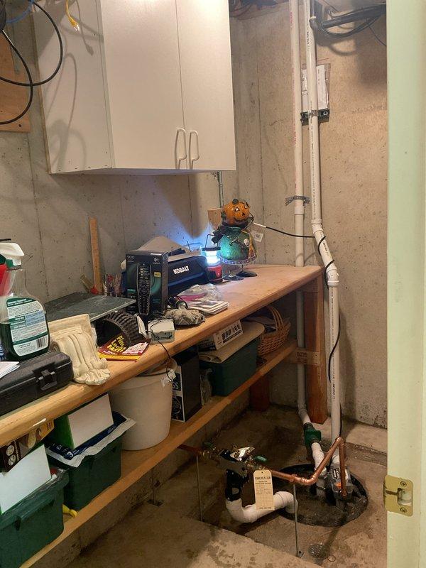 Installed water-powered backup sump pump system in basement utility area. Connected unit to existing plumbing infrastructure using PVC and copper piping with appropriate valves and fittings to ensure automatic activation during primary pump failure or power outage.