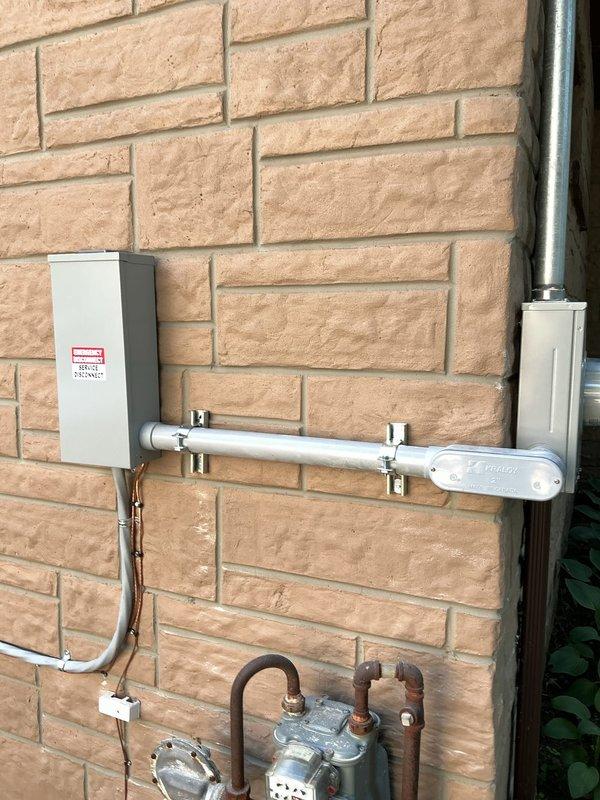 Completed 150-amp electrical service upgrade and panel installation. Installed new exterior meter base, weatherhead, and service entrance conductors on brick facade, along with proper grounding and conduit system. Ran new circuit wiring from exterior service entrance through interior utility space to new electrical panel, ensuring all connections meet current electrical code requirements.