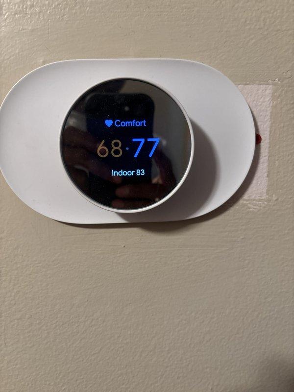 Completed full HVAC system installation including a 70,000 BTU furnace, 2.5-ton air conditioning unit with rear discharge configuration, humidifier, and modern programmable thermostat. Obtained mechanical and electrical permits prior to installation, reconnected existing electrical service, and ensured proper system integration with utility meter. System qualified for utility rebate program under AHRI certificate 215663829, confirming equipment efficiency standards were met.