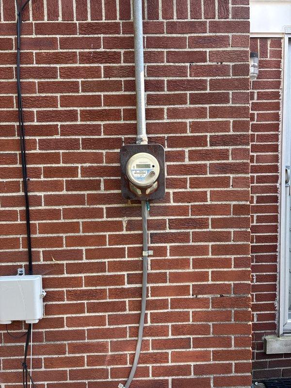 Completed full HVAC system installation including a 70,000 BTU furnace, 2.5-ton air conditioning unit with rear discharge configuration, humidifier, and modern programmable thermostat. Obtained mechanical and electrical permits prior to installation, reconnected existing electrical service, and ensured proper system integration with utility meter. System qualified for utility rebate program under AHRI certificate 215663829, confirming equipment efficiency standards were met.