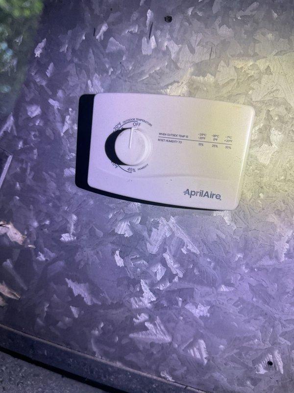 Responded to no-power condition on 20-year-old whole-house humidifier system in basement. Upon inspection, found AprilAire humidifier control with power supply issue affecting unit operation while main HVAC heating and cooling systems remained fully functional. Diagnosed electrical failure, documented existing equipment configuration including control settings and wiring connections. Consulted with owner on repair versus replacement options given age of unit. Customer elected to proceed with replacement at later date; completed diagnostic service and provided recommendations for system upgrade.