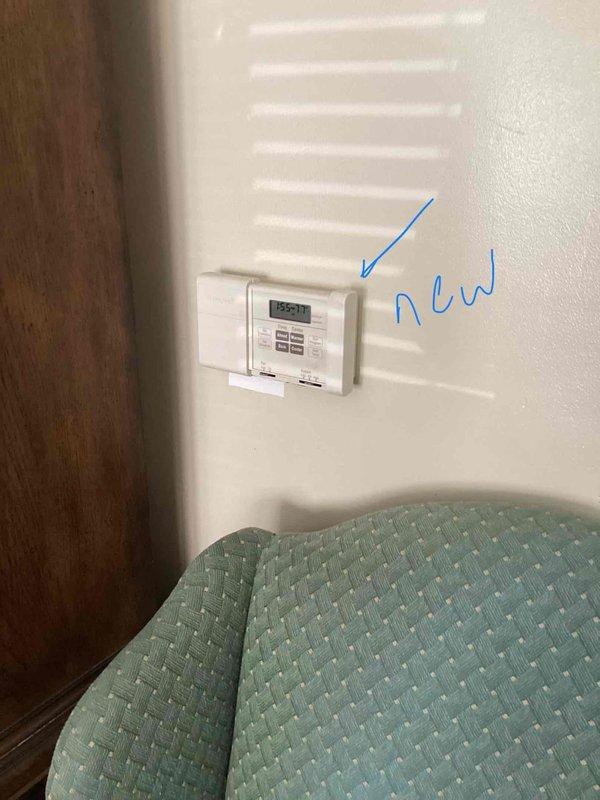Responded to service call for non-operational air conditioning system affecting entire residence. Upon inspection, discovered 30-year-old furnace with cracked heat exchanger requiring immediate replacement due to safety concerns. Evaluated 30-year-old evaporator coil and 12-year-old condenser unit operating on R22 refrigerant, found system low on refrigerant charge. Assessed existing thermostat and determined replacement necessary for proper system operation. Provided comprehensive estimate for complete HVAC system replacement including new high-efficiency furnace, evaporator coil, condenser unit, and programmable thermostat. Presented optional APCO air purification system to address indoor air quality concerns. Documented equipment conditions with photographs of existing thermostat location and mechanical room configuration showing water heater, ductwork, and HVAC components. Reviewed all replacement options and recommendations with homeowner for full system upgrade.