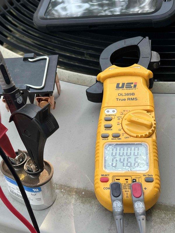 Completed comprehensive Gold AC inspection on 18-year-old single-unit air conditioning system with basement-located air handler. System was operational upon arrival. Performed full electrical diagnostics using True RMS digital multimeter and clamp meter to verify voltage, amperage, and capacitor functionality. Measured electrical components including capacitor performance and circuit integrity. All readings documented and photographed for service records. Unit confirmed to be functioning within acceptable parameters at time of inspection.