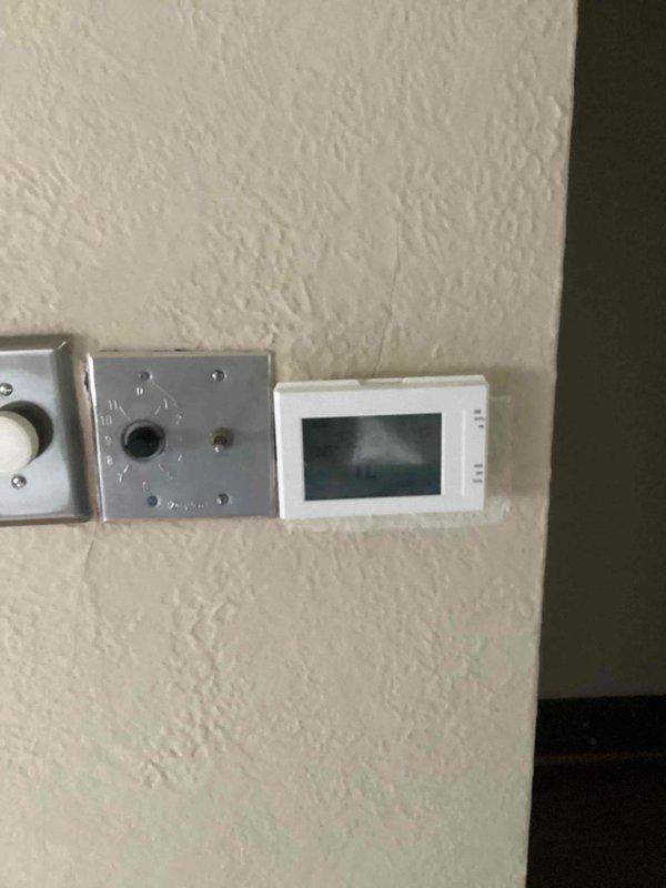 Responded to service call for nonfunctional attic-mounted heat pump with no heating or cooling capability. Performed system evaluation and provided comprehensive estimate for full HVAC system replacement due to unit age and complete system failure. Documented existing equipment configuration including return air vent locations and thermostat control setup for replacement specifications.