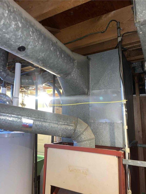 Provided comprehensive estimate for complete HVAC system replacement in basement location, including both air conditioning unit and natural gas furnace. Current 50-year-old AC system experiencing refrigerant leak requiring replacement, while existing furnace assessed for upgrade compatibility. Documented existing ductwork configuration, electrical connections, and equipment placement to ensure proper sizing and installation planning for new high-efficiency system.